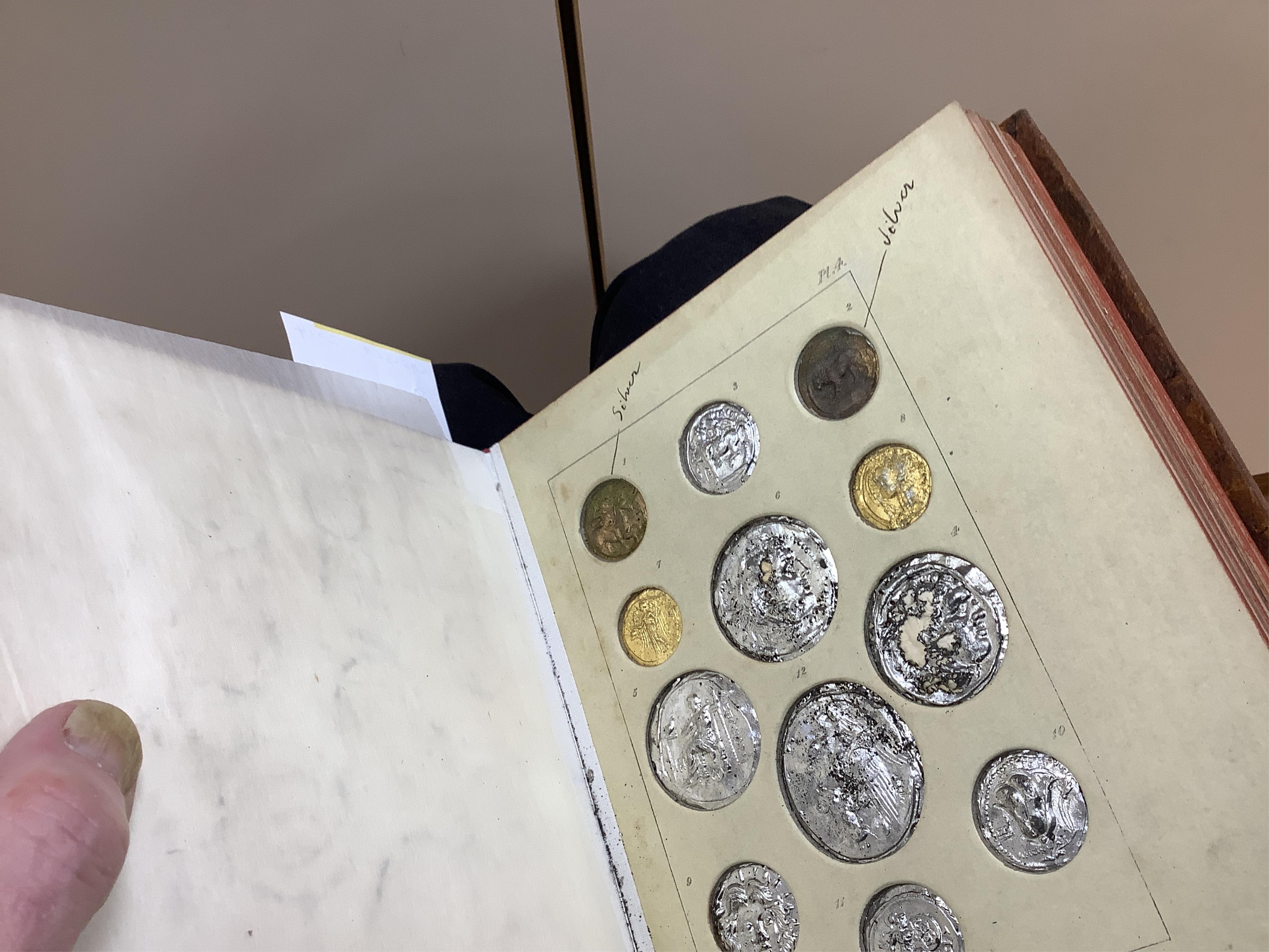 Humphreys, Henry Noel. Ancient Coins and Medals. London: Grant and Griffith, 1850. Octavo, original elaborately embossed full brown calf, marbled endpapers with 114 relief facsimiles of coins and medals on ten thick moun